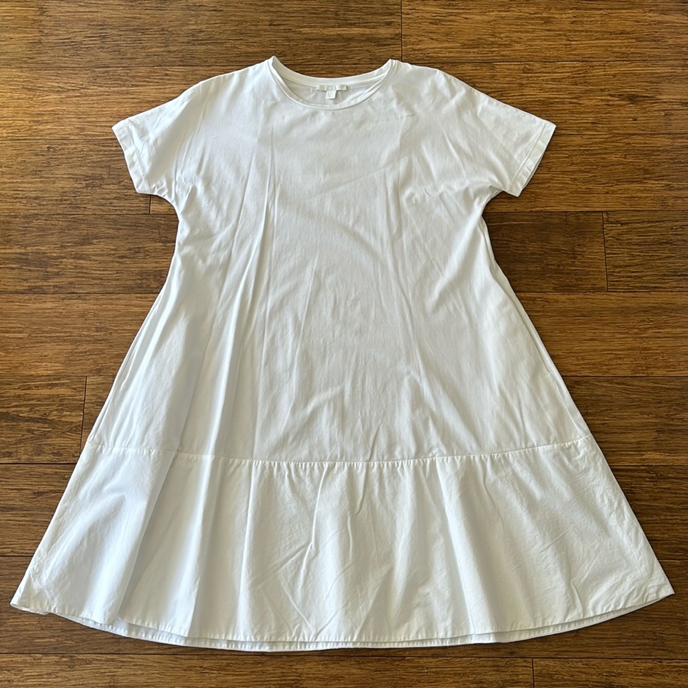 COS white flowy cotton dress with pockets. Fits right on the knee.